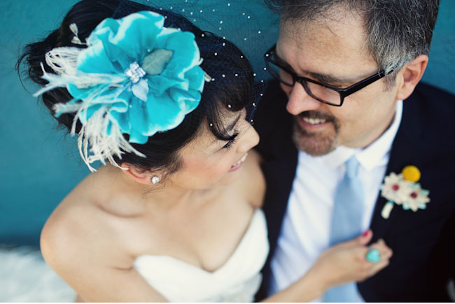 bride with teal flower hairpiece