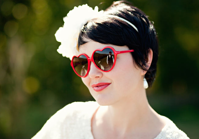 bride wearing heart sunglasses
