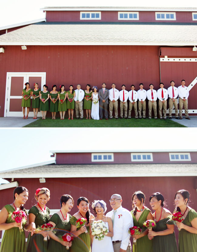 wedding party in front of red barn