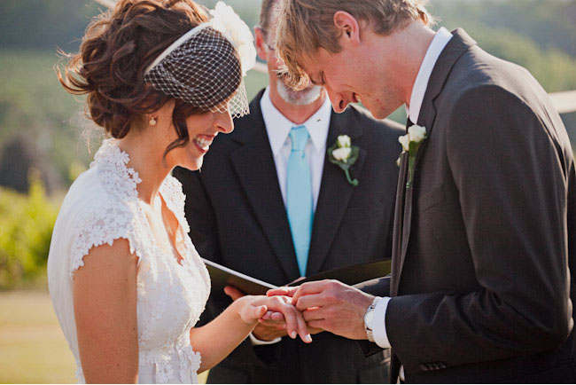 bride and groom exchanging rings