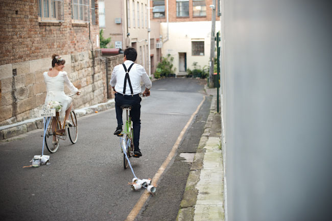 bride and groom on bicycles