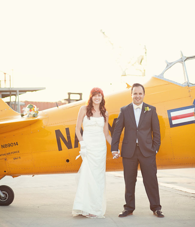 bride and groom with airplane