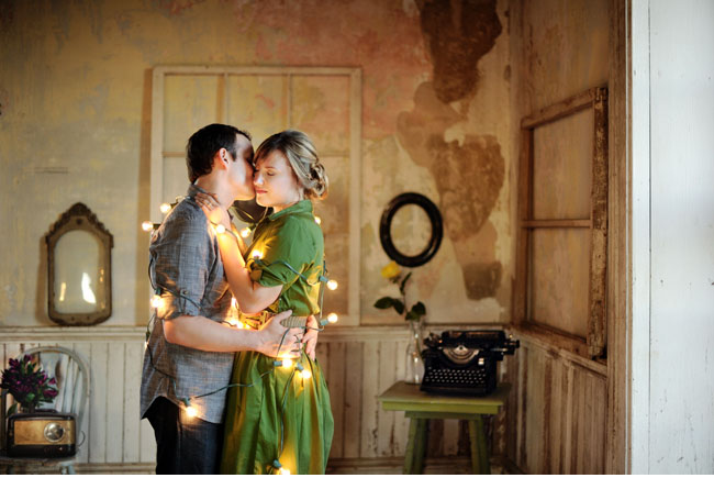 couple wrapped in lights