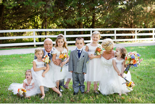 bride and groom with flower girls and ring bearer