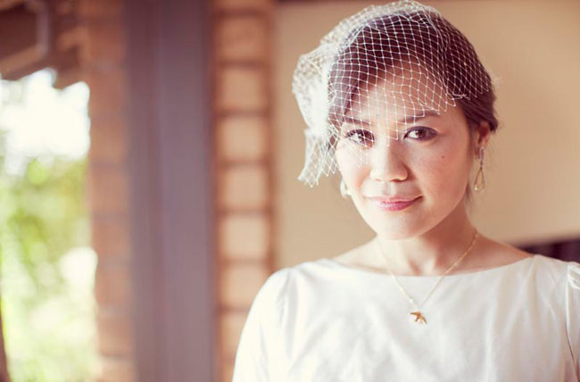 bride wearing birdcage veil