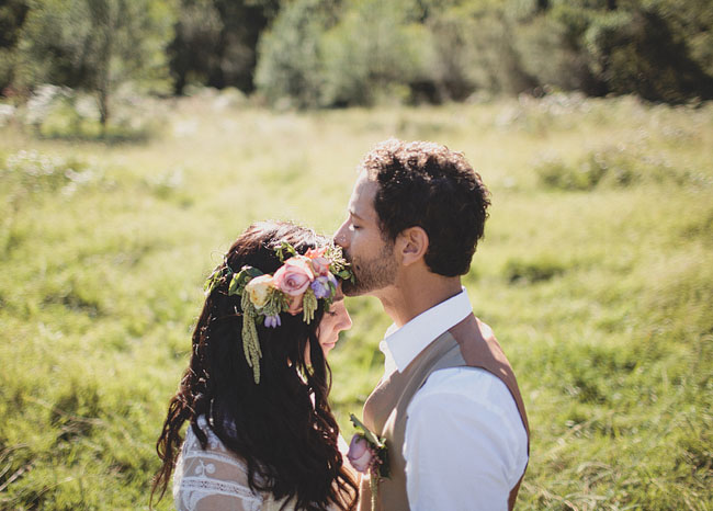 bride with floral crown kiss