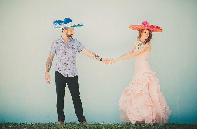bride and groom wearing sombreros