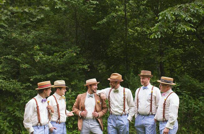 groomsmen wearing hats and suspenders