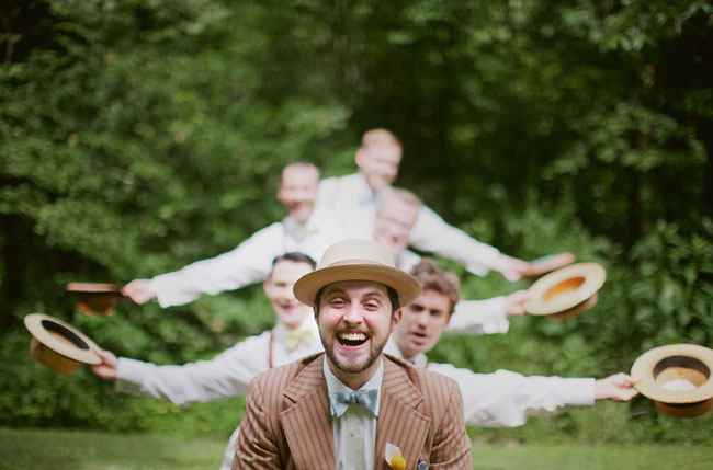 groomsmen wearing hats and suspenders