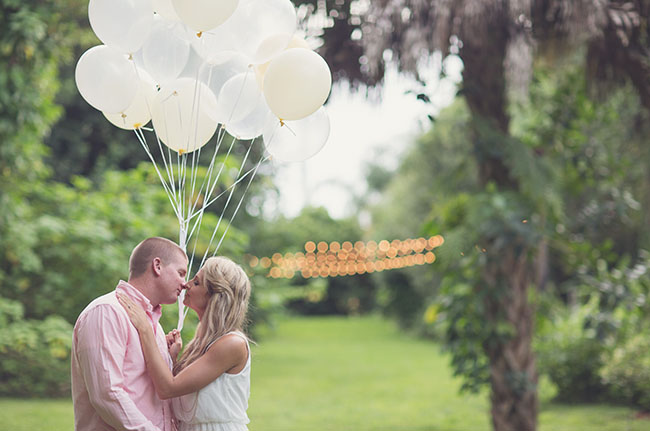 couple holding balloons