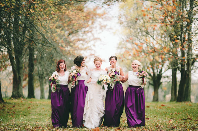 bridesmaids in purple skirts