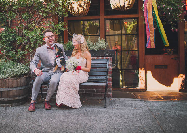 bride and groom with pup
