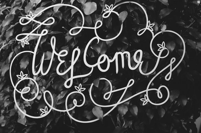 welcome calligraphy sign