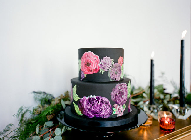rose painted black cake