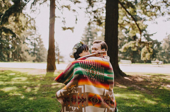 bride and groom wrapped in blanket