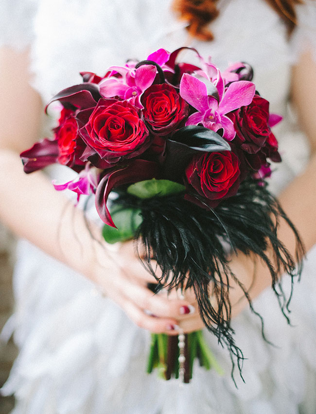 red rose and black feather bouquet