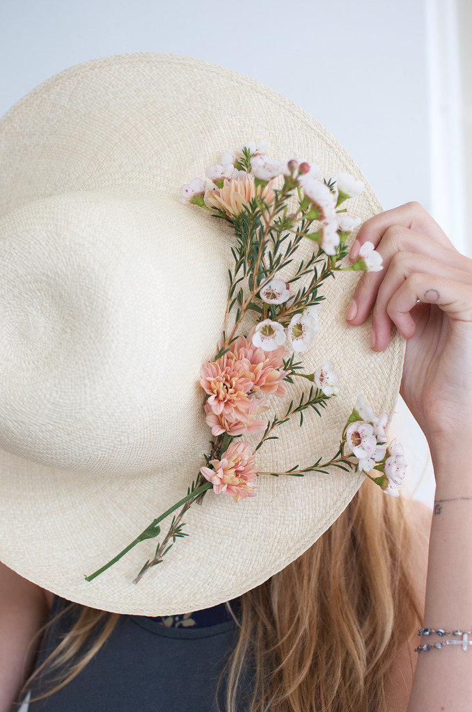 hat with fresh flowers