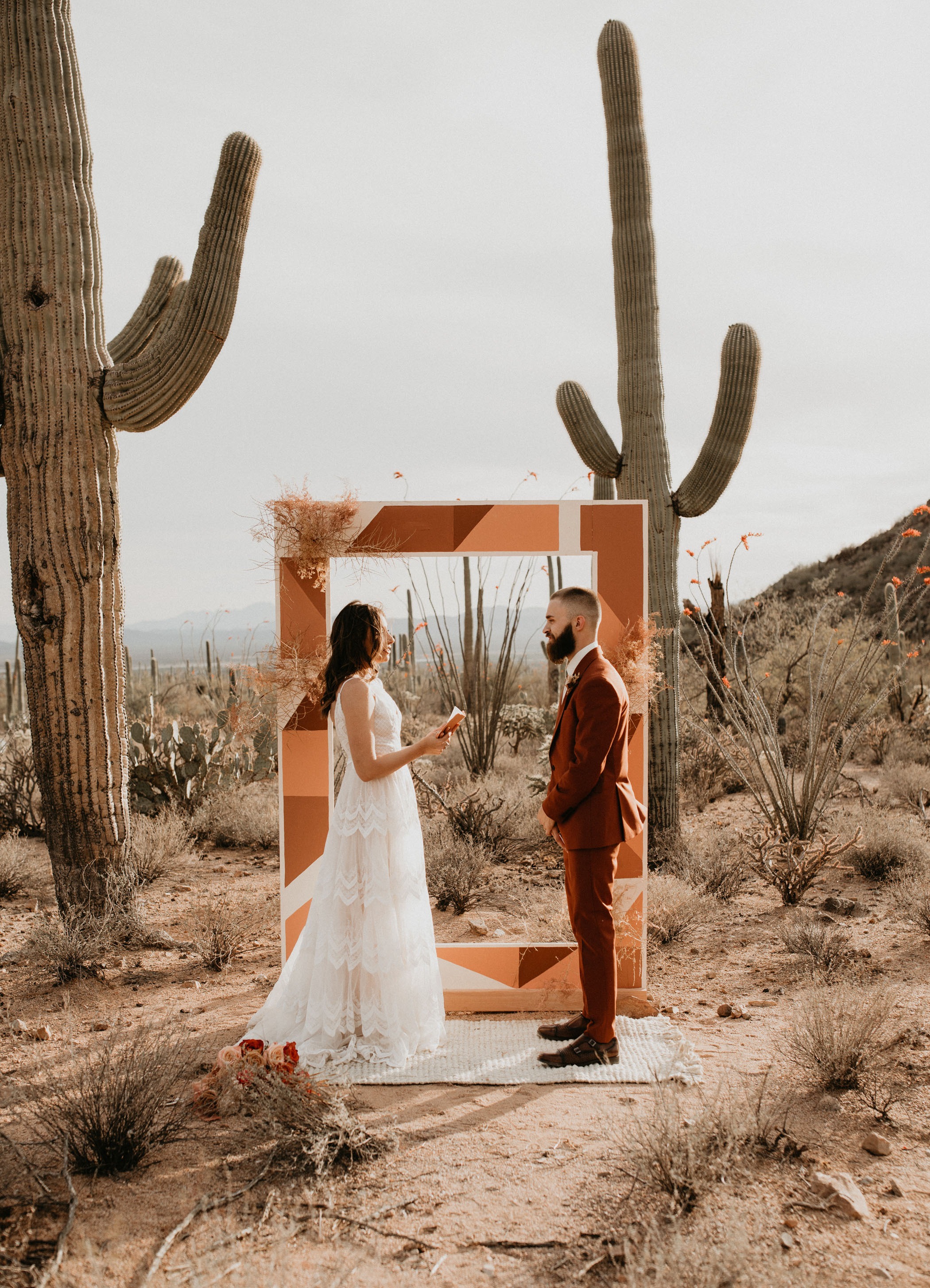 geometric painted wood rectangle DIY wedding backdrop for a desert elopement