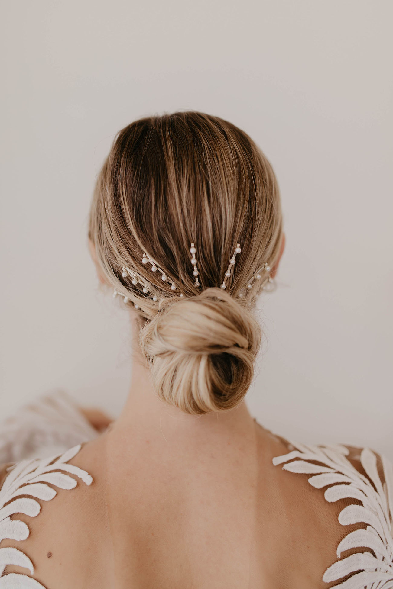 bridal hair ideas, low chignon, pearl pins