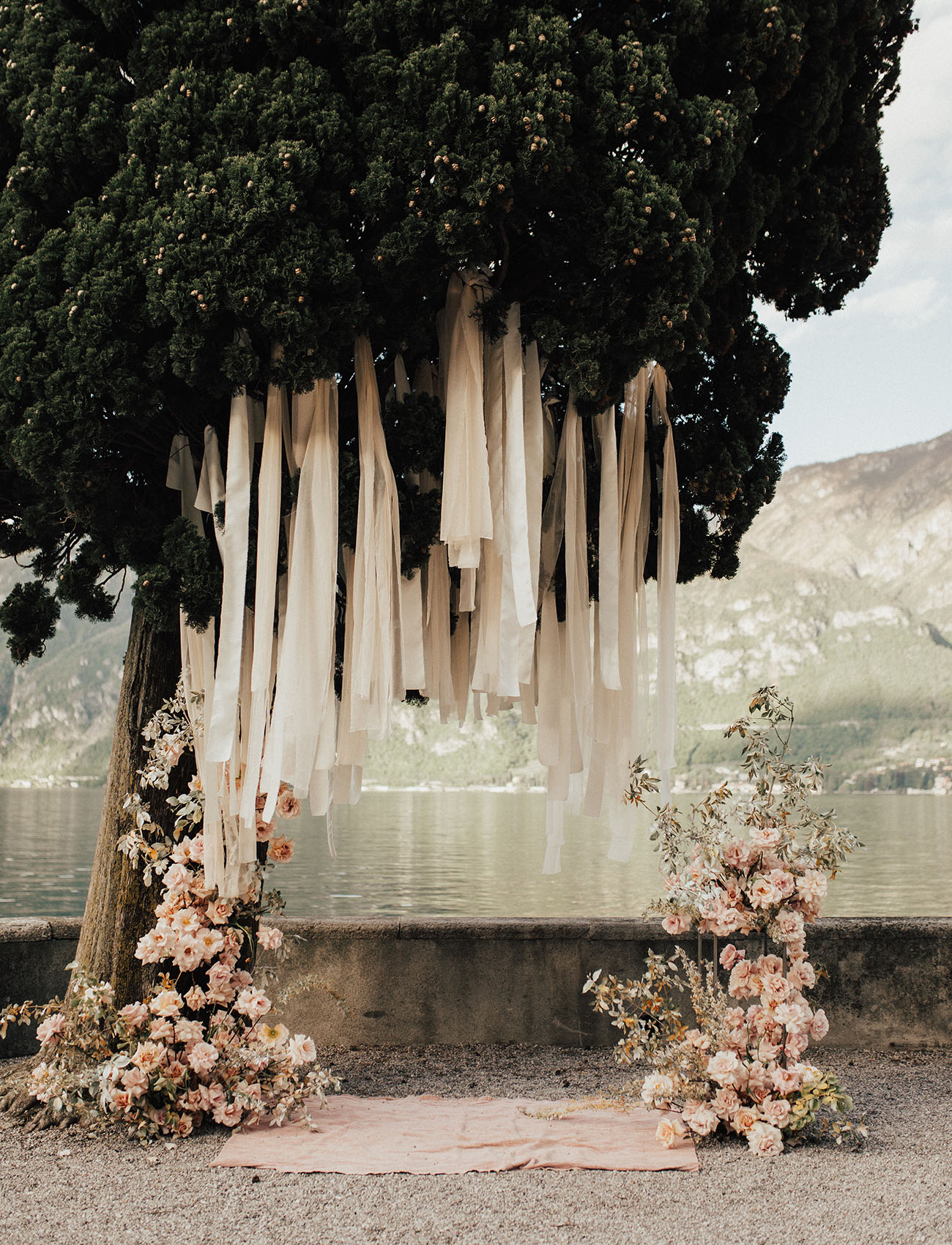 mono-floral Wedding ceremony installation of peach and blush roses