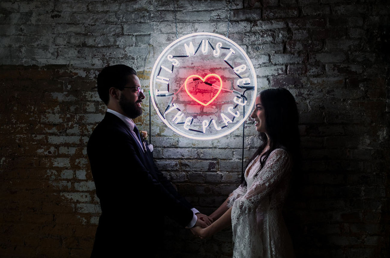Bride and Groom with Neon Sign