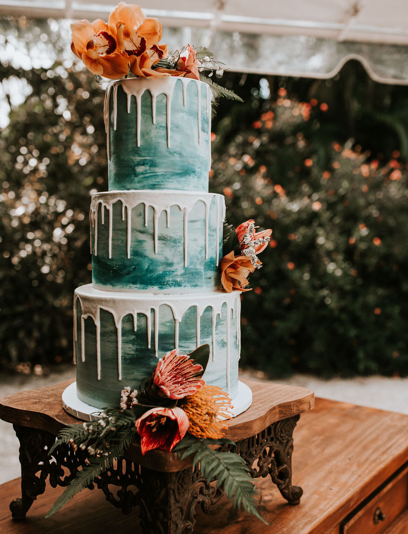 teal drip wedding cake