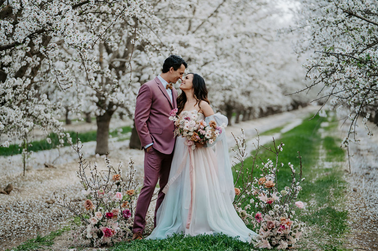 micro wedding ideas - couple in a cherry three fields