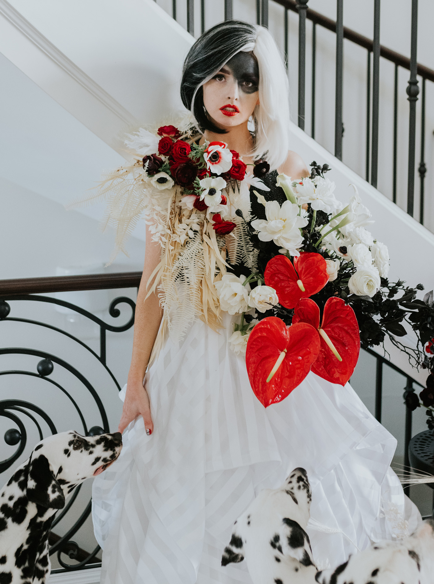 cruella bride with red bouquet