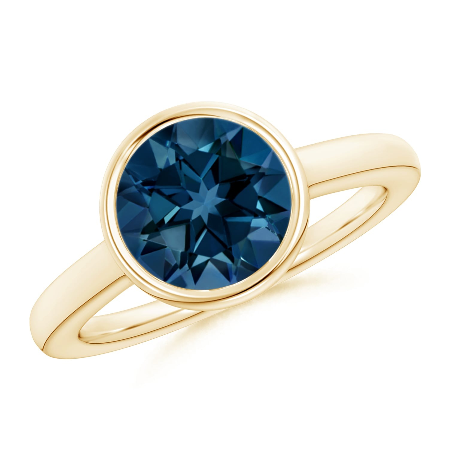 bezel set London blue topaz gemstone non diamond engagement ring with a yellow gold band