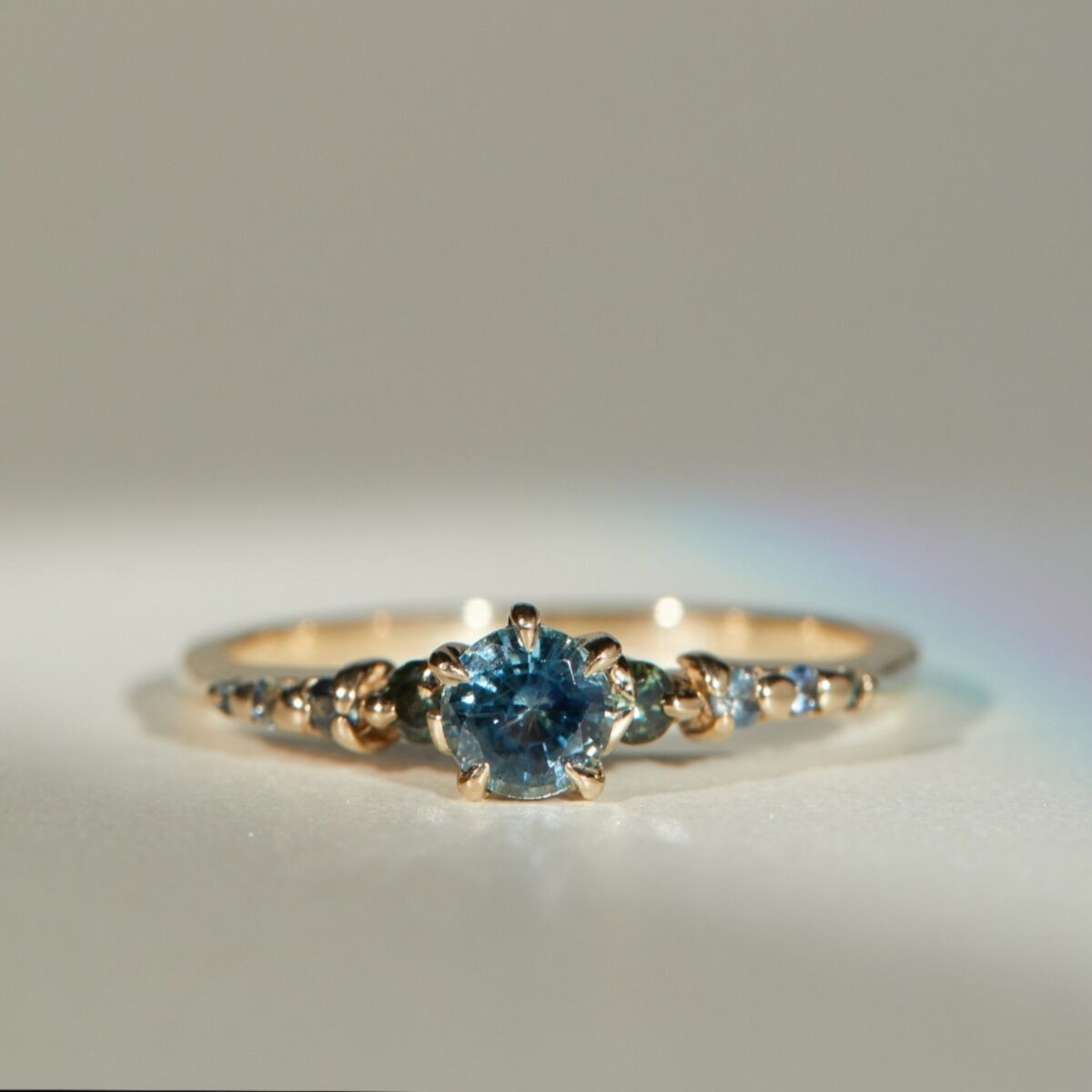 blue and green gemstone engagement ring