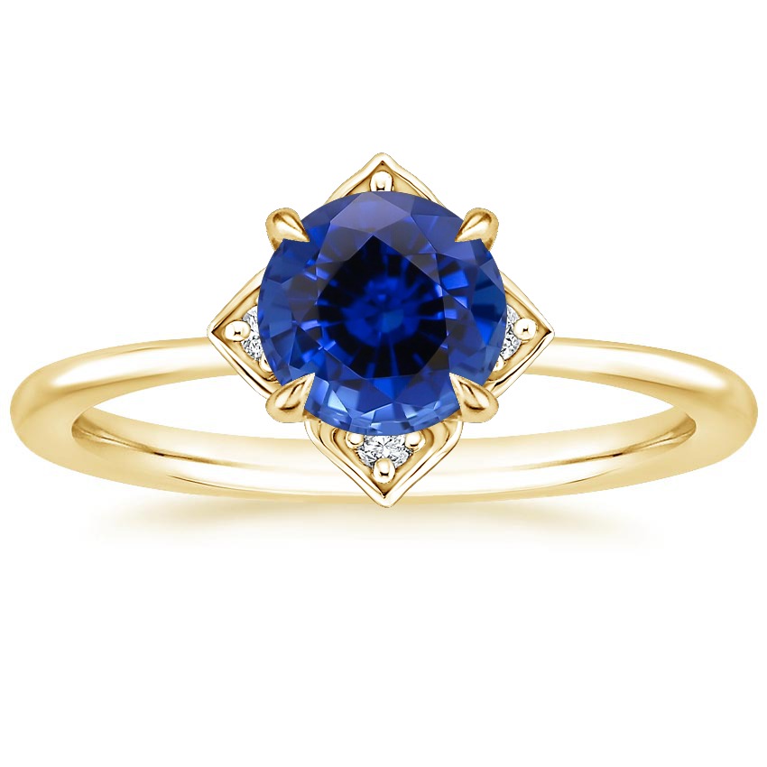 alternative non diamond engagement ring with sapphire gemstone and gold band