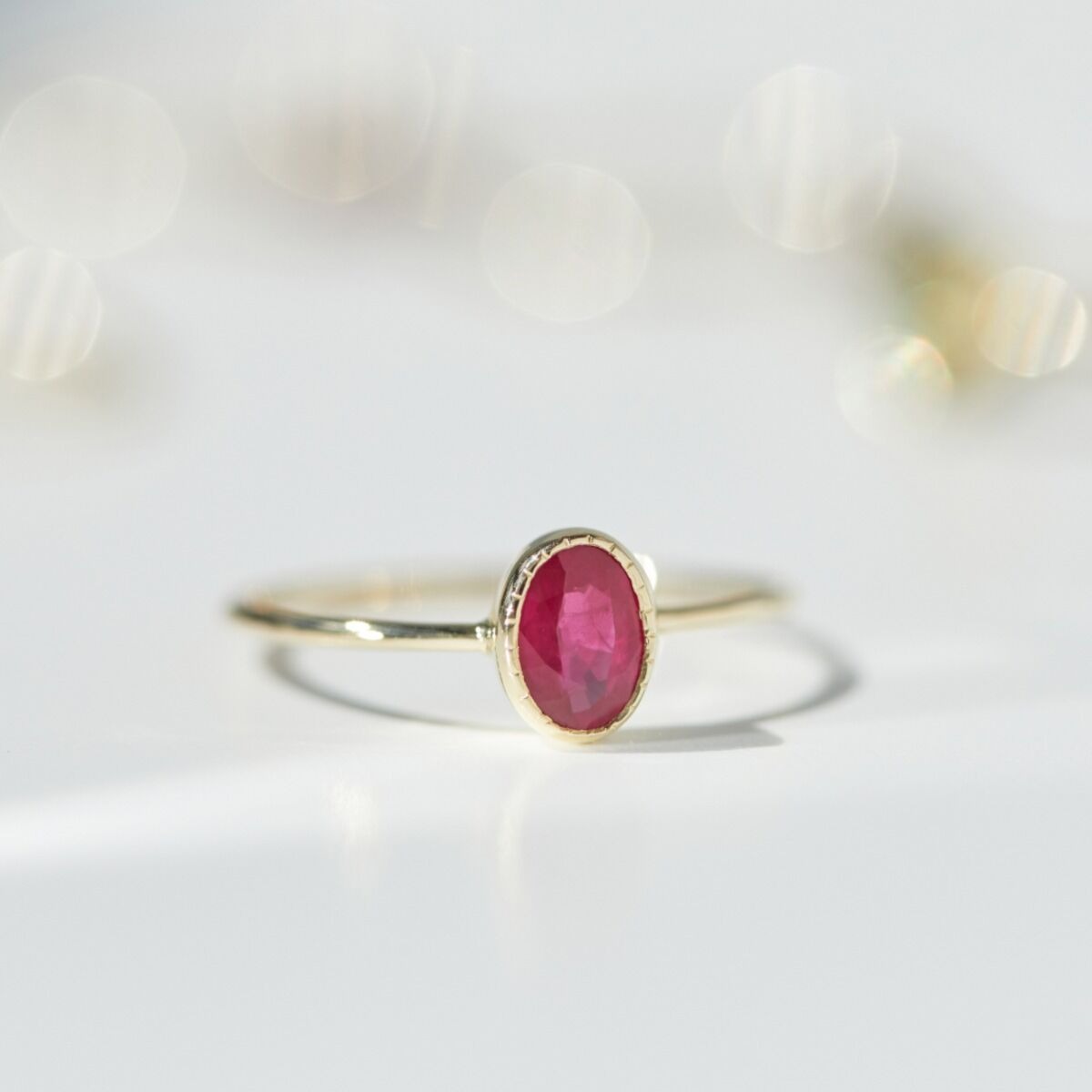 oval ruby ring with simple gold band