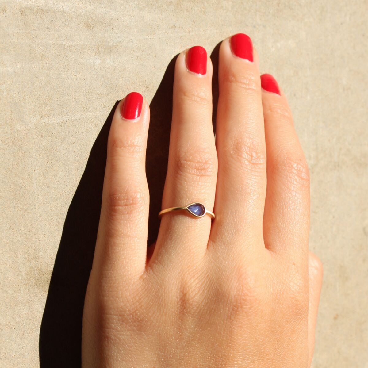 tiled pear shaped sapphire gemstone engagement ring