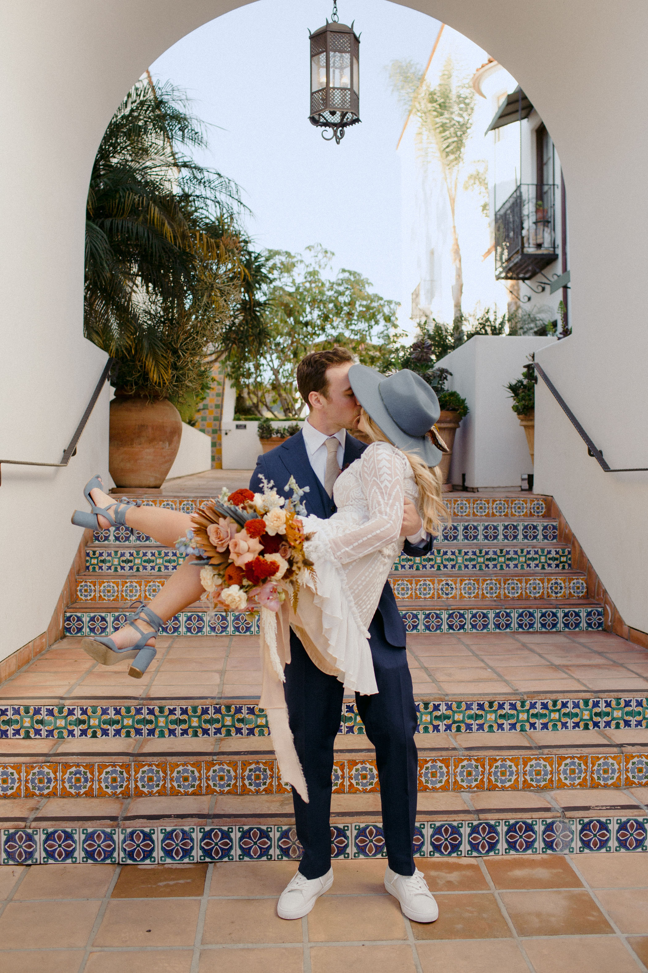 kissing on the steps of the Santa Barbara Courthouse post civil ceremony