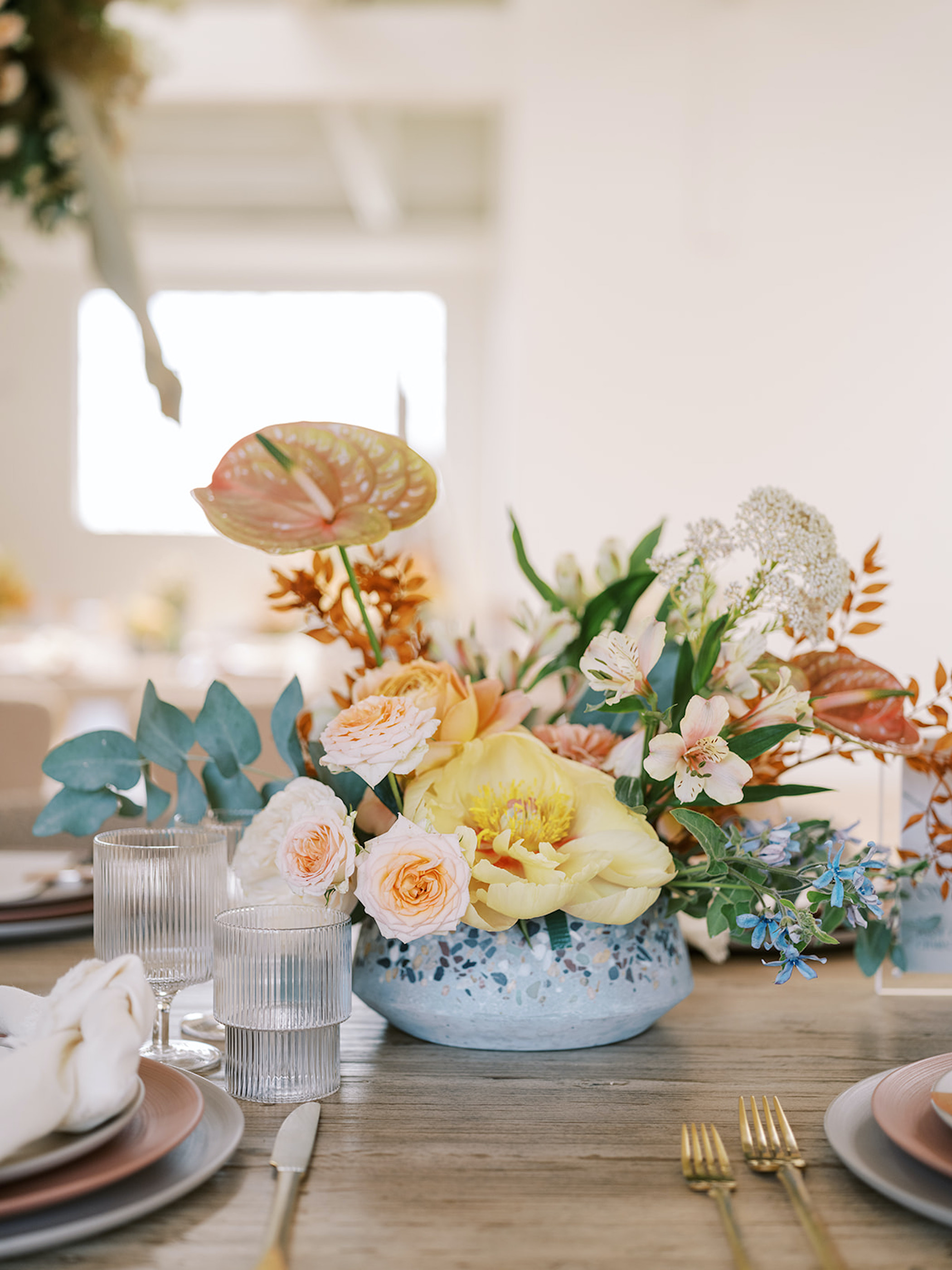 terrazzo party ideas with hanging florals