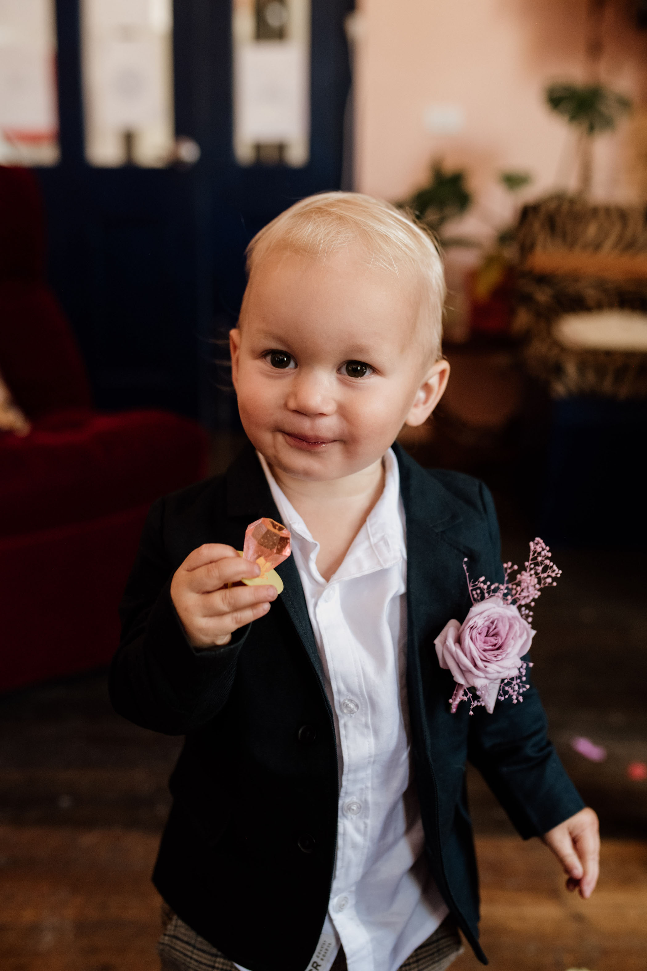 toddler eating a ring pop