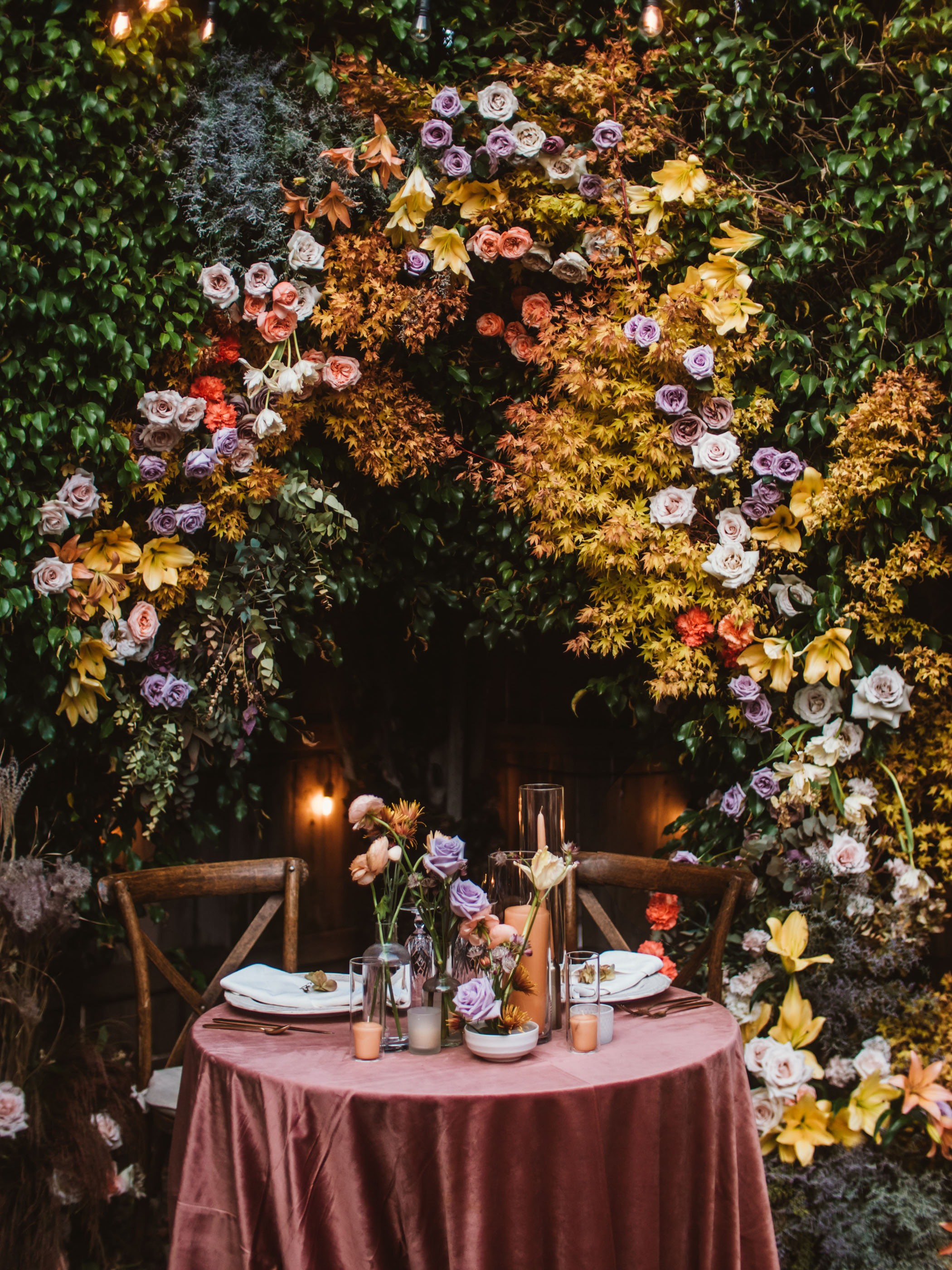 Purple and orange flower wedding reception