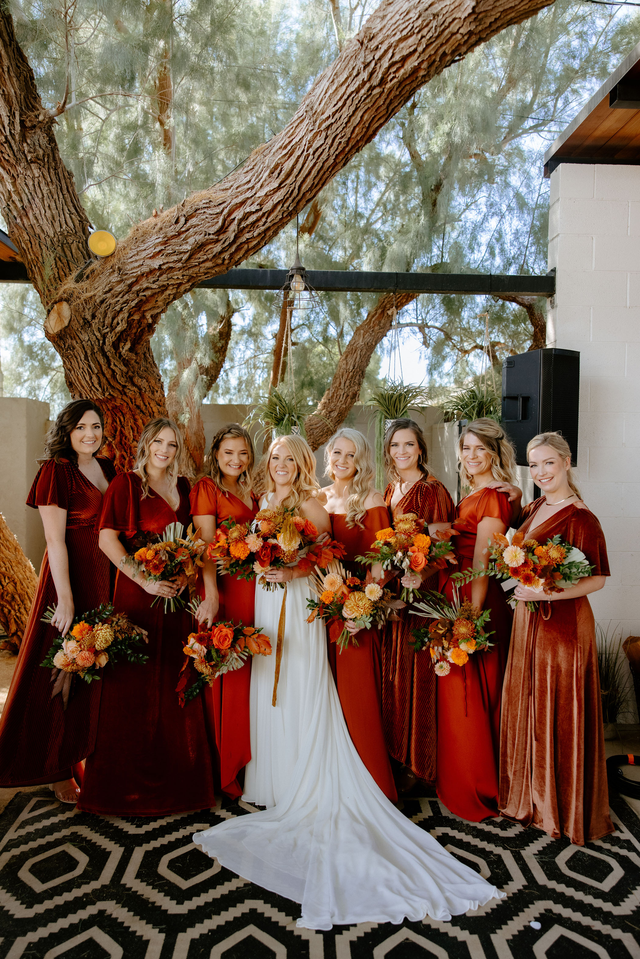 bridesmaids in rust colored dresses