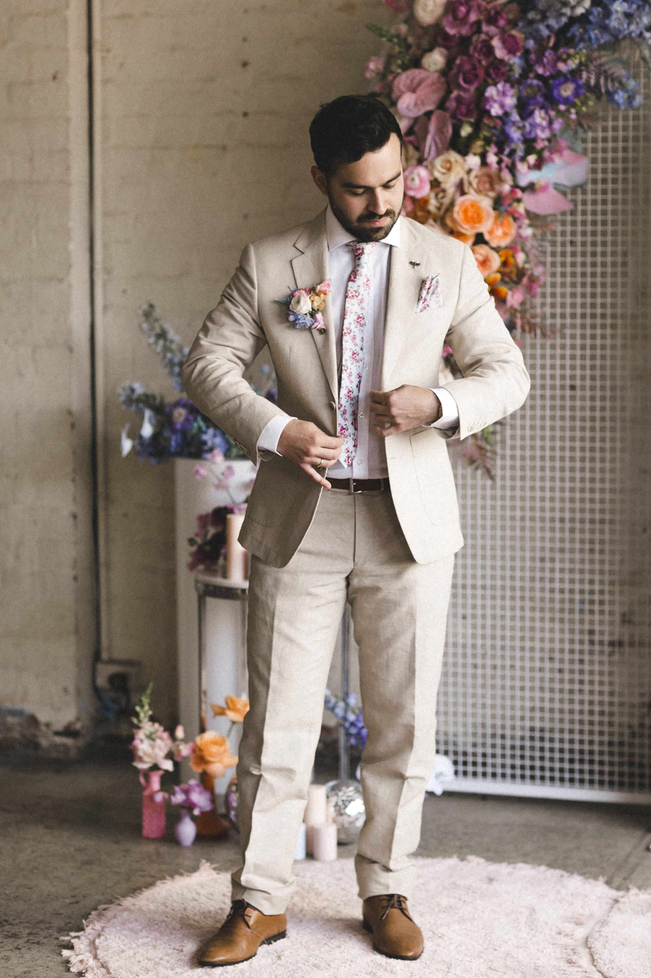 groom in beige toned suit