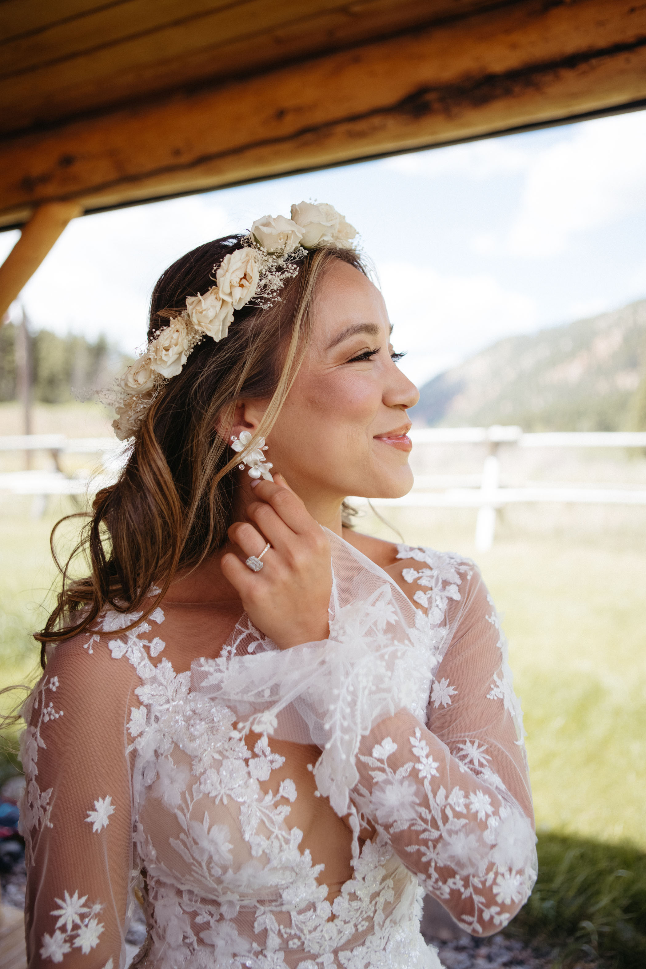 bride wearing white flower crown