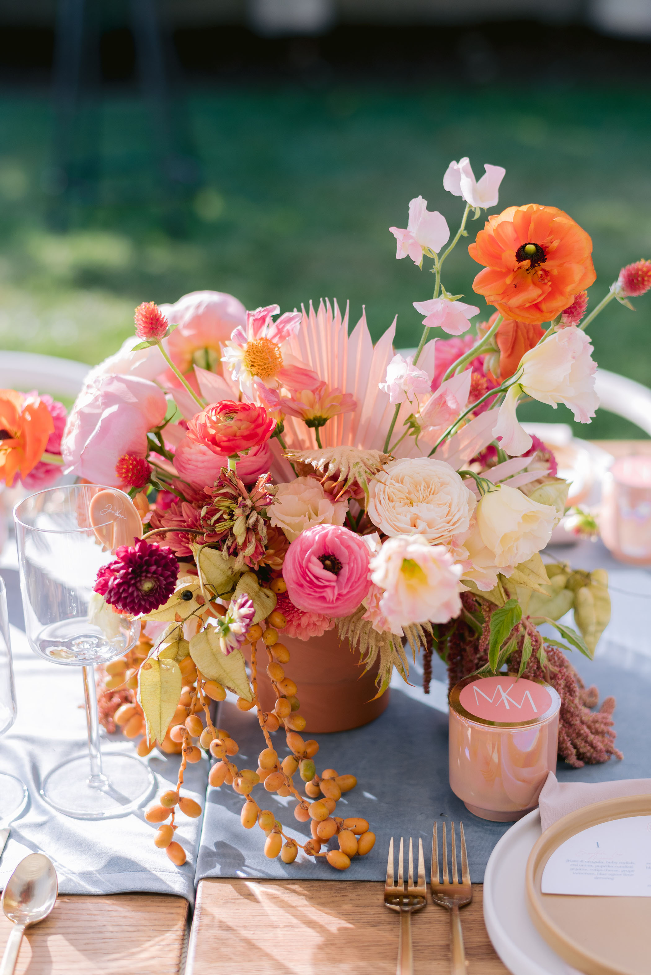 pink and orange floral centerpiece display for housewarming party table