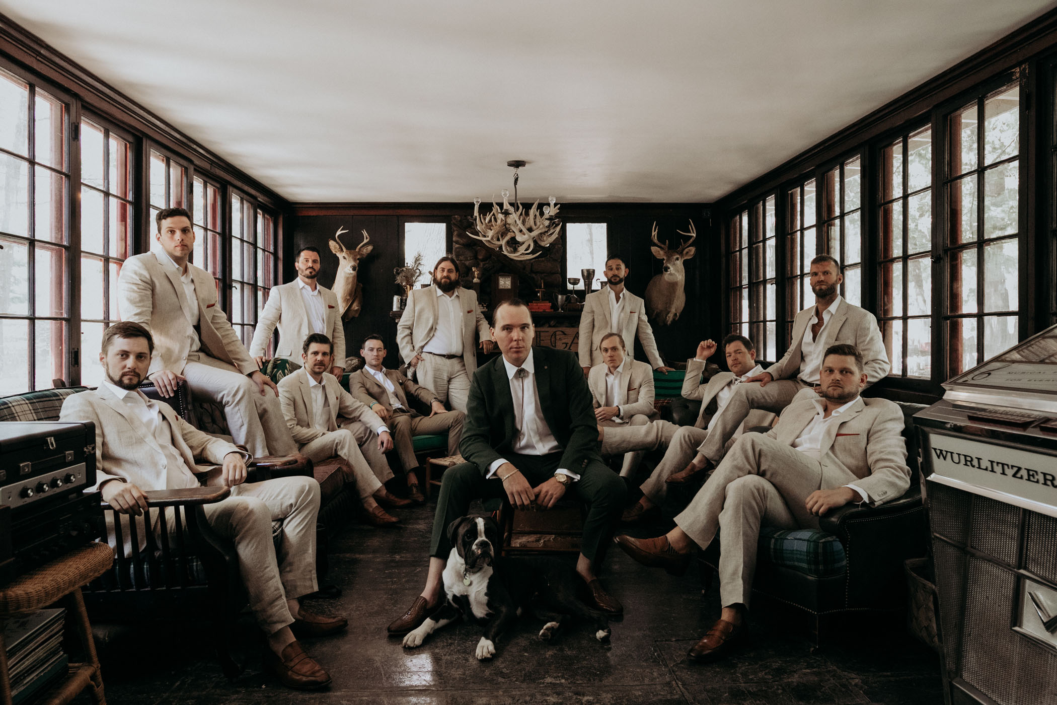 groomsmen in a sitting pose for the camera