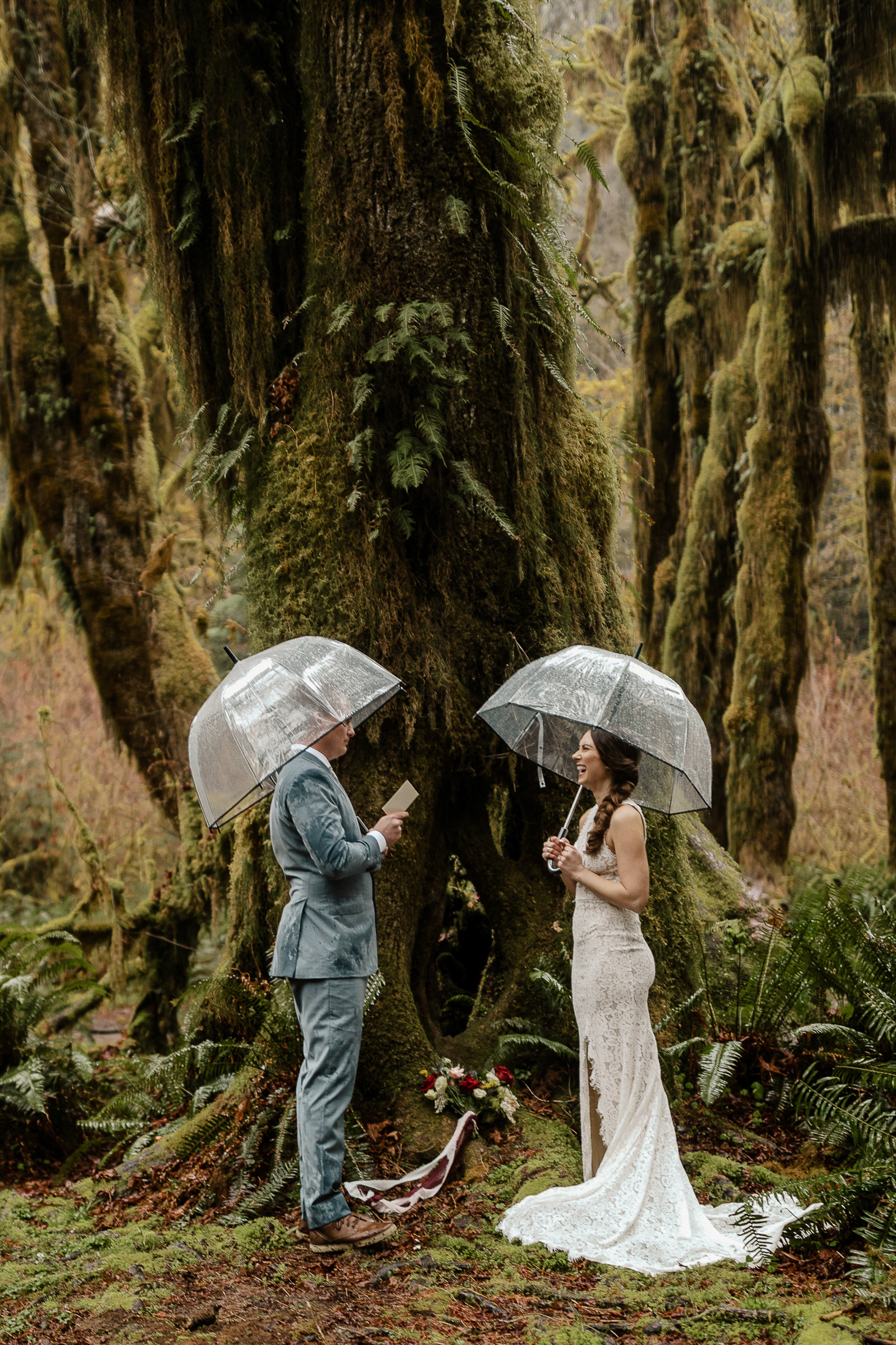 Bride and groom saying vows in a rainforest