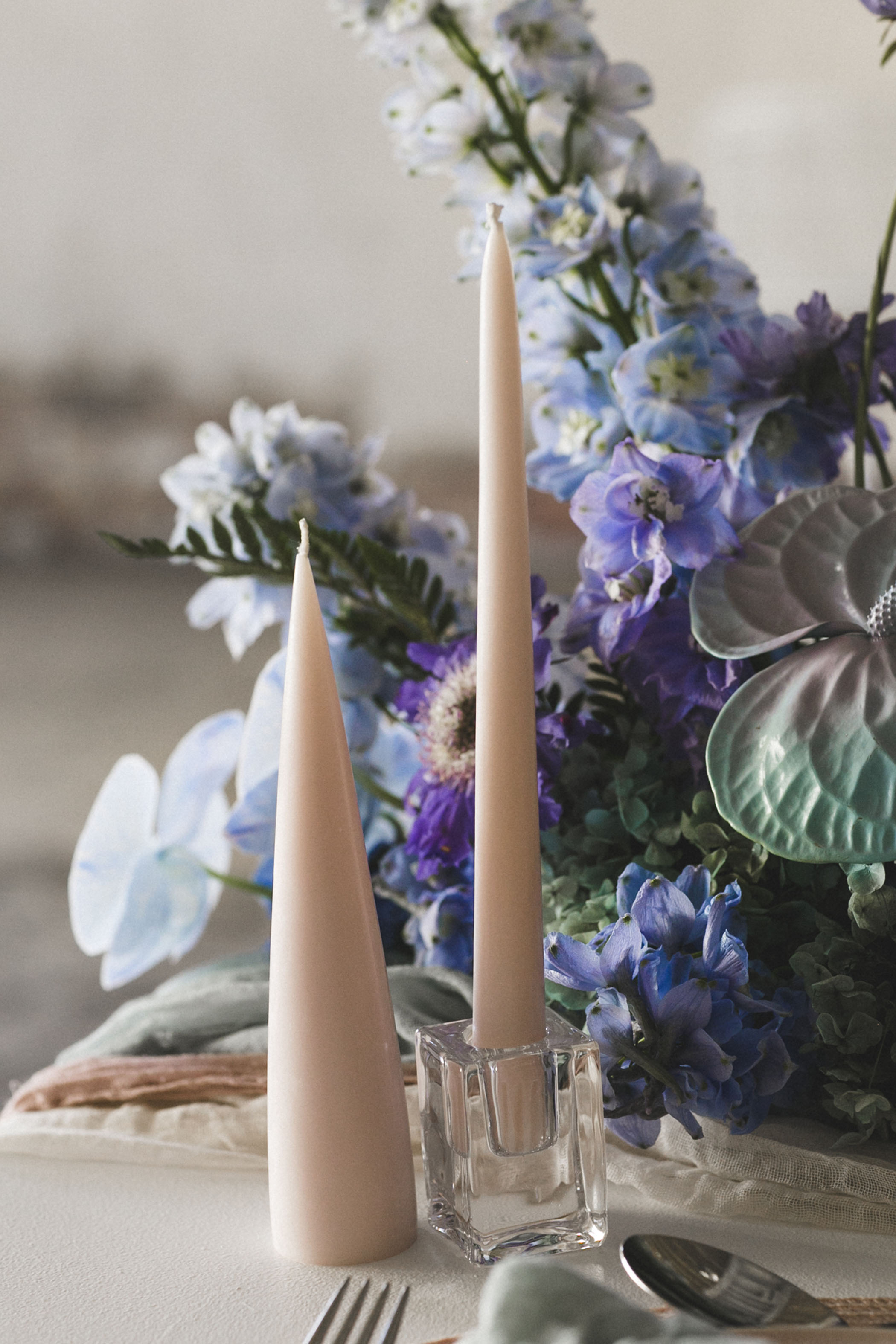 peach candles and purple wedding reception florals