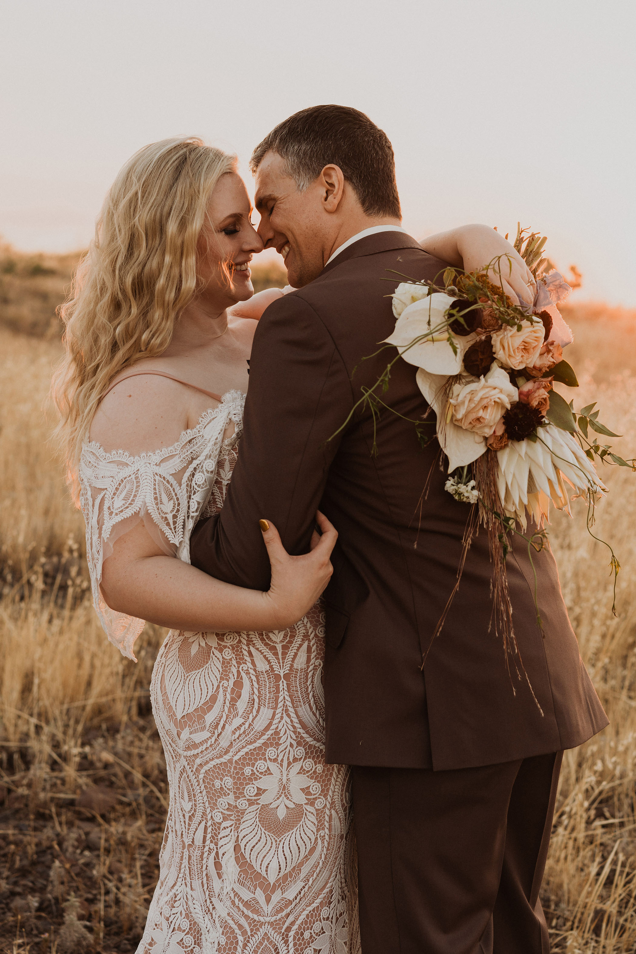 bride and groom kissing in arcosanti arizona