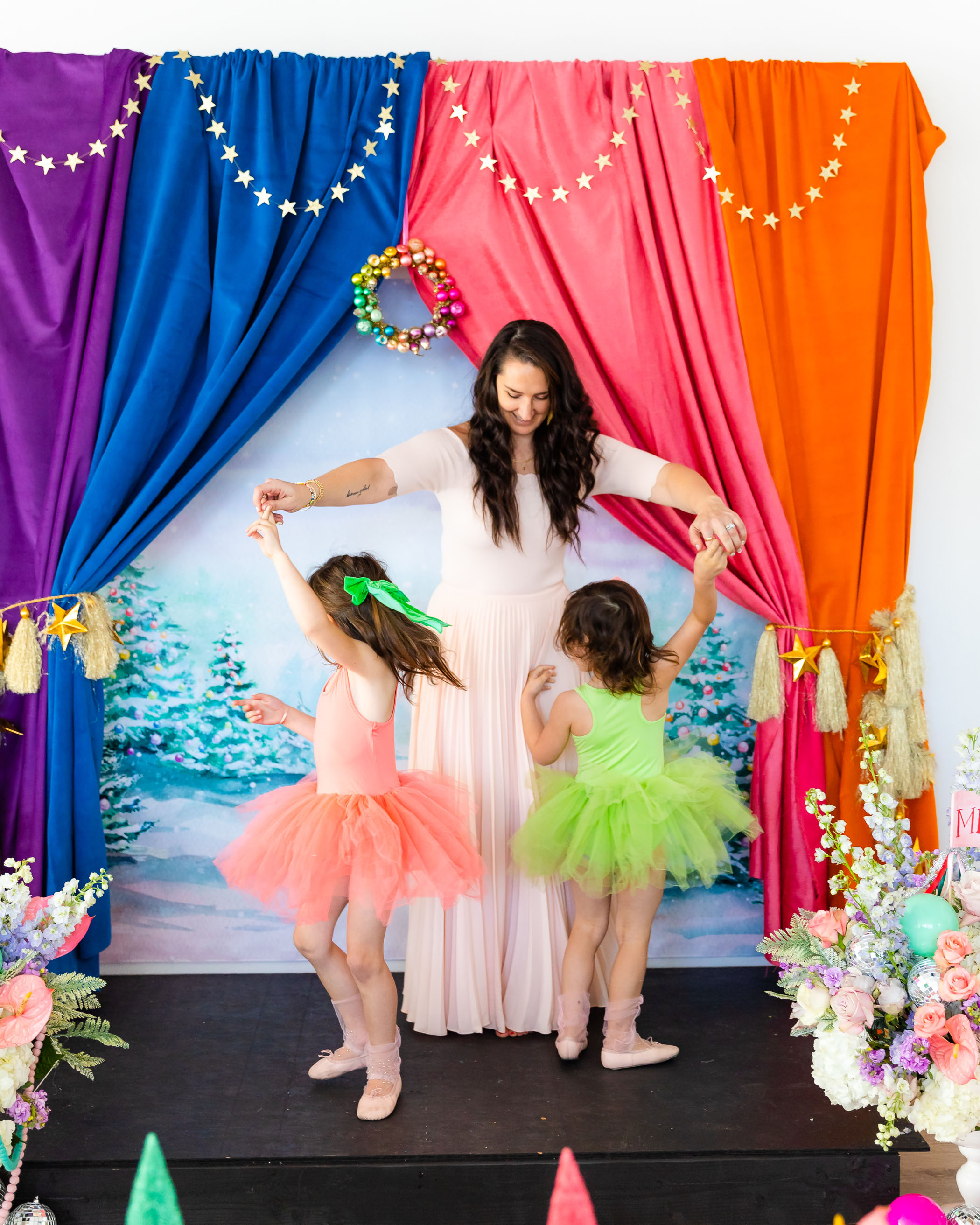 Little girls in colorful tutus twirling