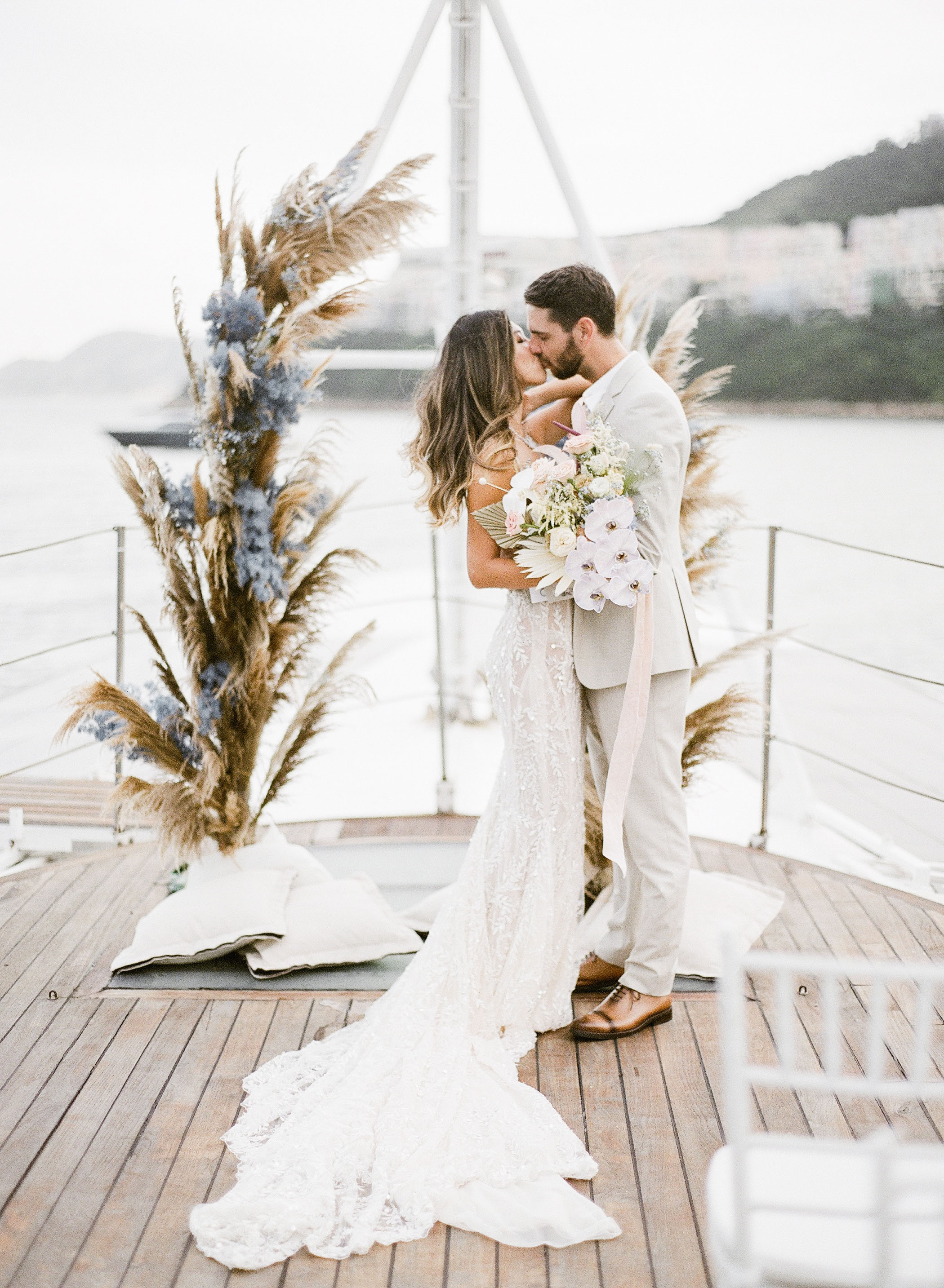 Bride and groom getting married on a yacht
