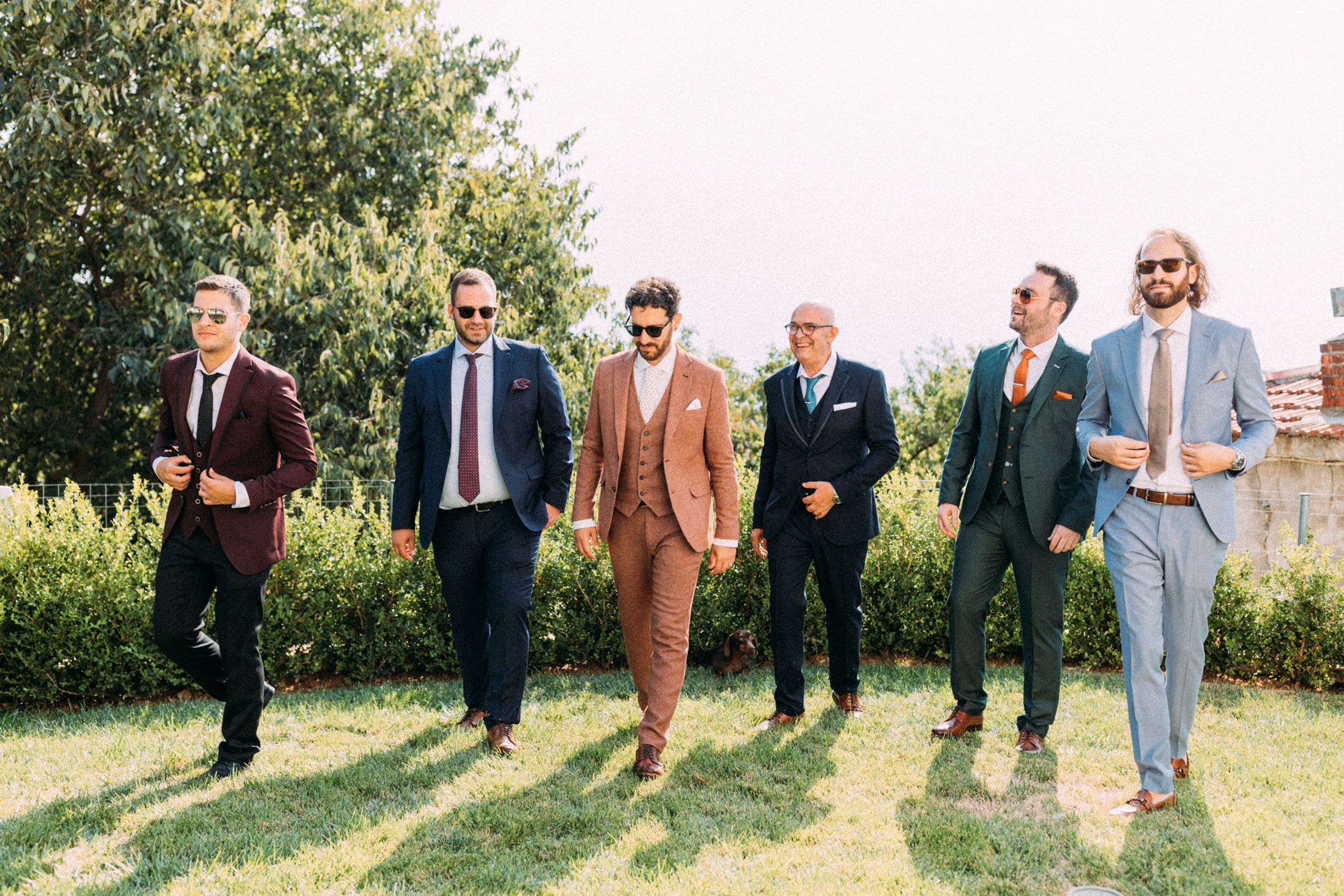 groom and groomsmen in mismatched suits