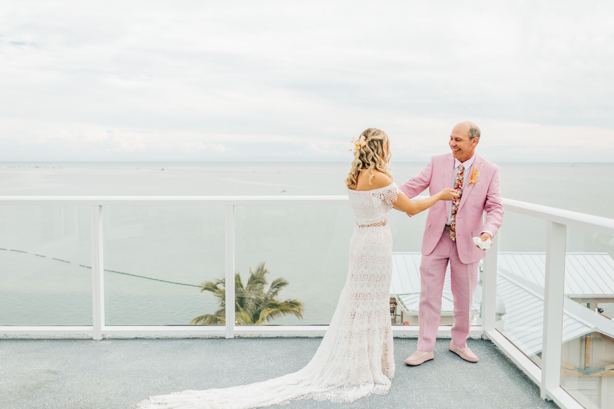 Father of the bride in pink suit
