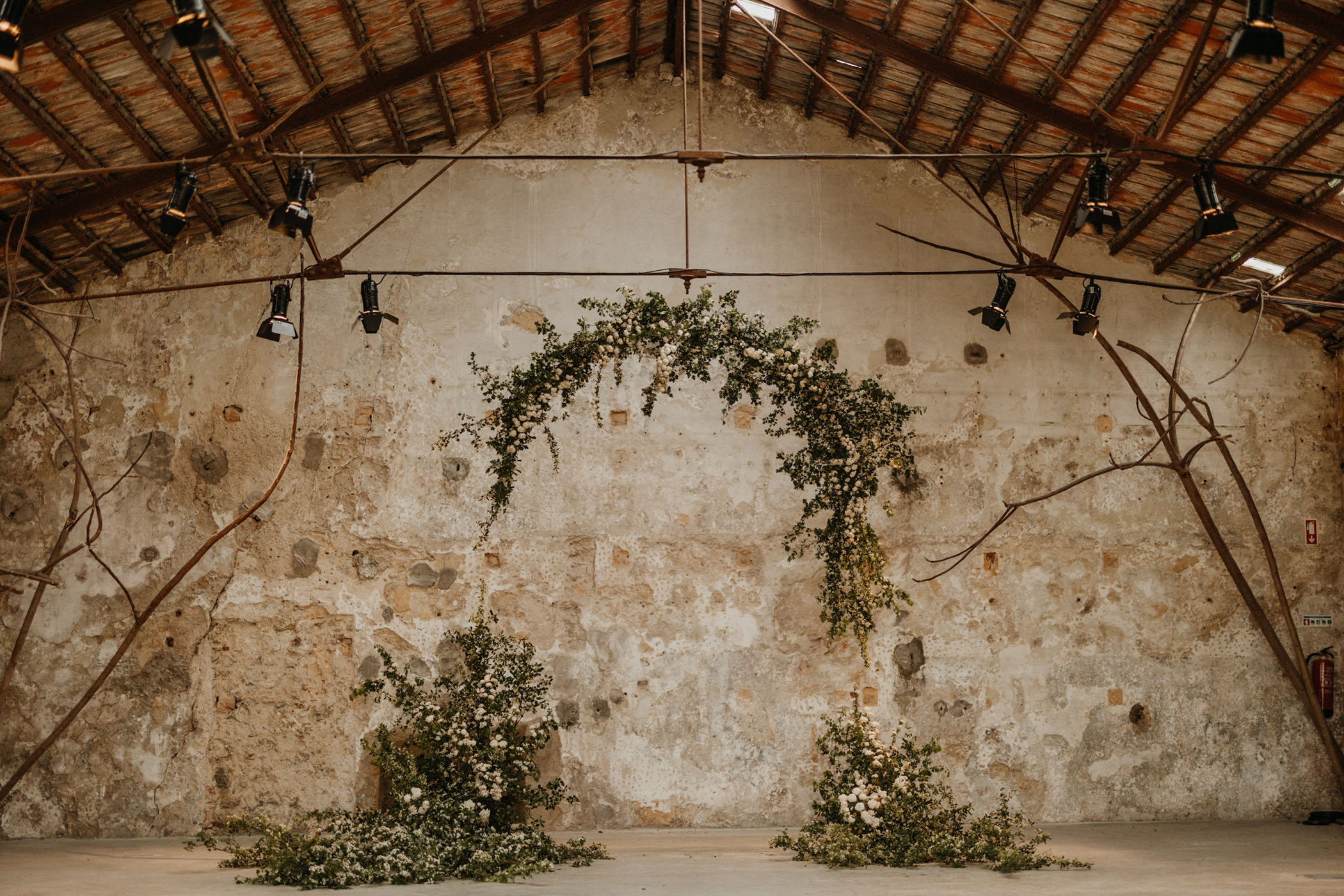 Industrial greenery ceremony arch